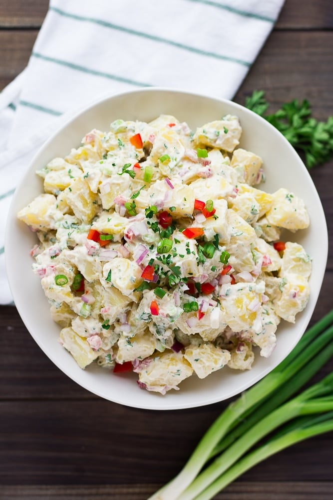 vegan potato salad in a white bowl