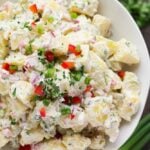 close up of vegan potato salad in white bowl