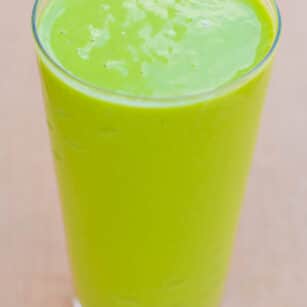 A tropical green smoothie with a handful of healthy ingredients.