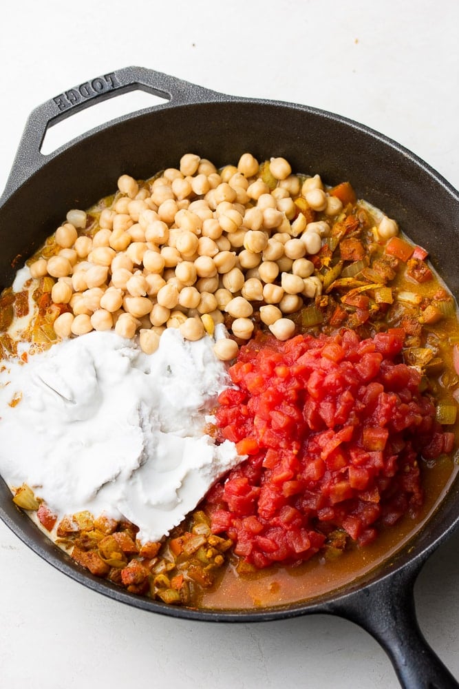 pan full of coconut milk, chickpeas and canned tomatoes, not mixed