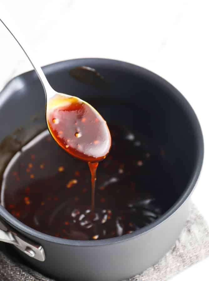 teriyaki sauce on a spoon from a pot