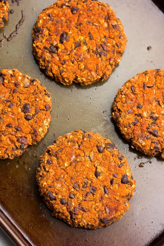 looking down on cooked sweet potato black bean burgers on a pan