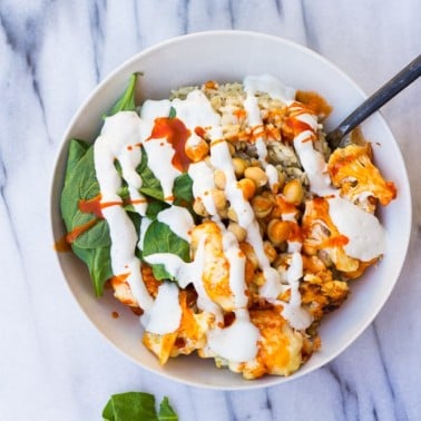 Buffalo Cauliflower Buddha Bowl- Roasted Buffalo Cauliflower, brown rice, spinach, chickpeas and cashew cream.