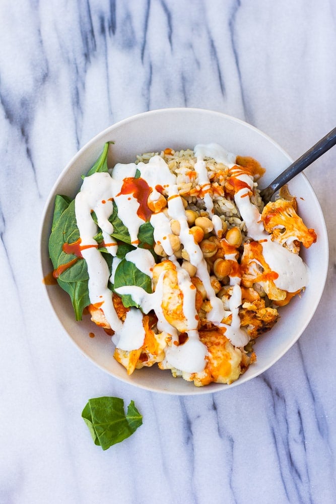 Buffalo Cauliflower Buddha Bowl- Roasted Buffalo Cauliflower, brown rice, spinach, chickpeas and cashew cream.