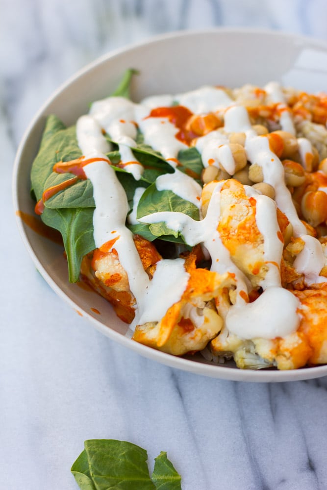 Buffalo Cauliflower Buddha Bowl- Roasted Buffalo Cauliflower, brown rice, spinach, chickpeas and cashew cream.