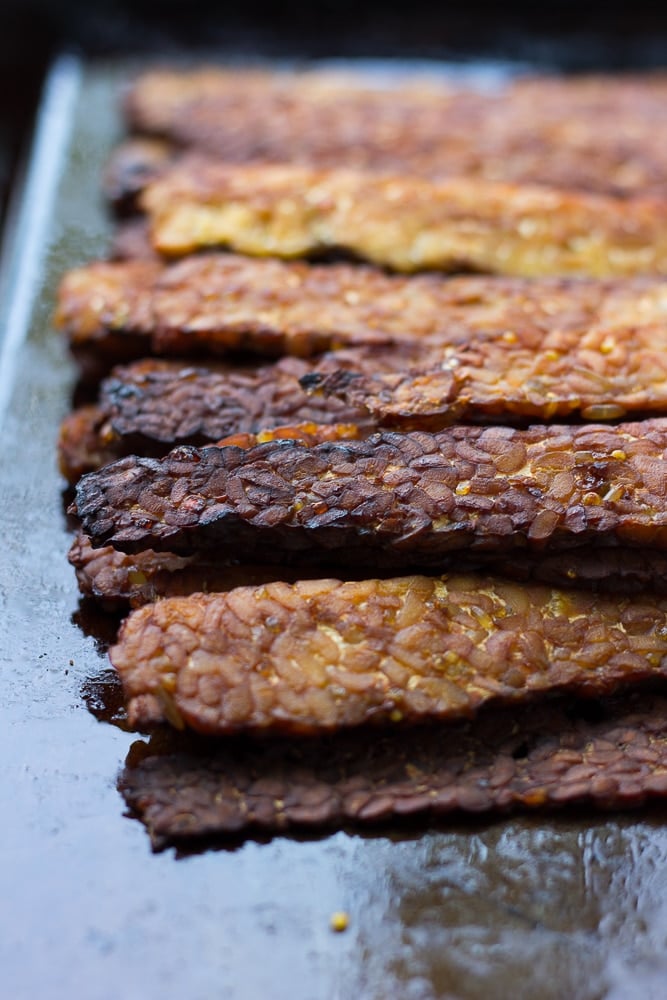 baked tempeh bacon on a pan