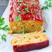 vegan meatloaf on a wooden board with parsley