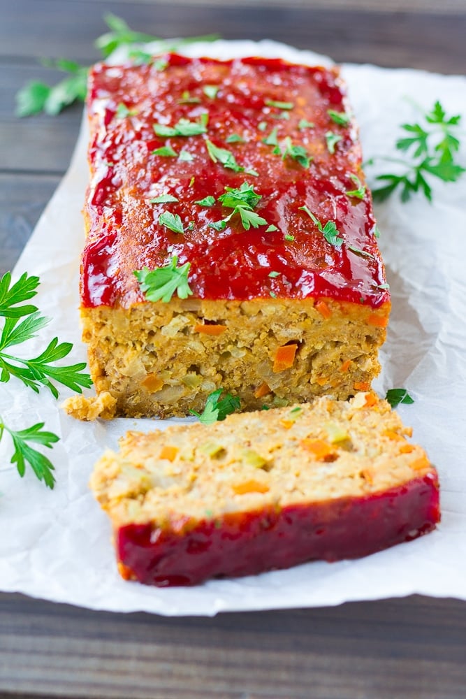 vegan meatloaf on a wooden board with parsley