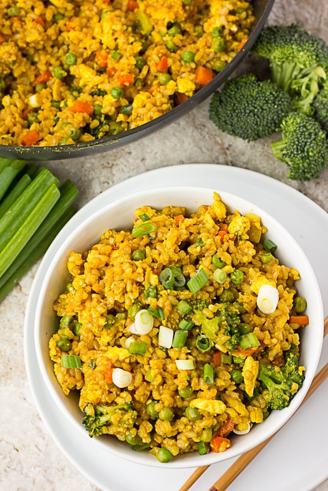 looking down at a bowl of golden fried rice