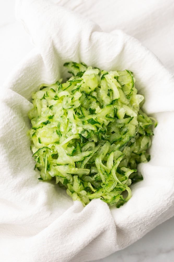 grated cucumber in a white towel