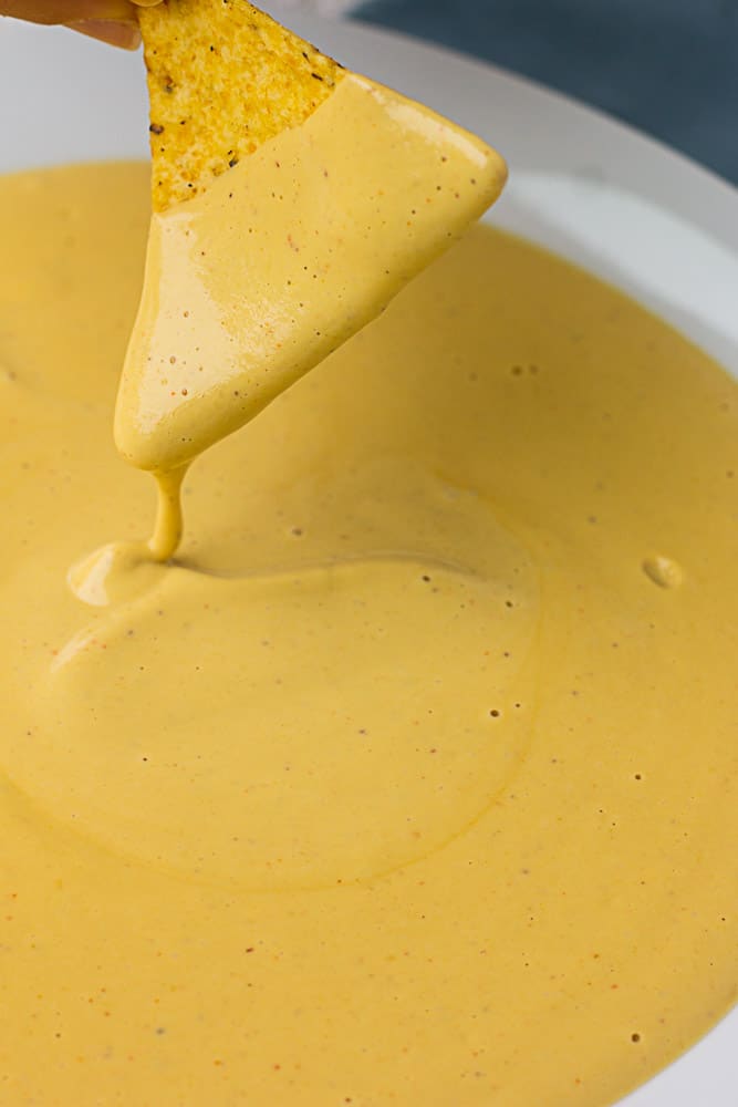Easy Vegan Nacho Cheese Sauce: Made with cashews, this vegan nacho cheese sauce is a cinch to make, healthy and kid-friendly!