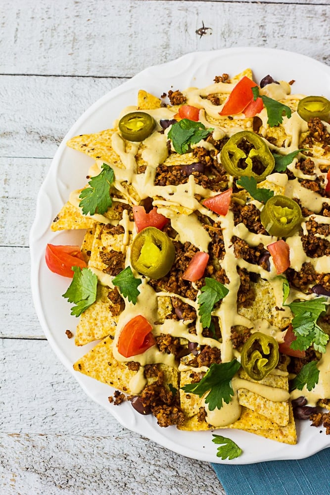 Ultimate Fully Loaded Vegan Nachos: with vegan nacho cheese sauce and vegan taco "meat"!