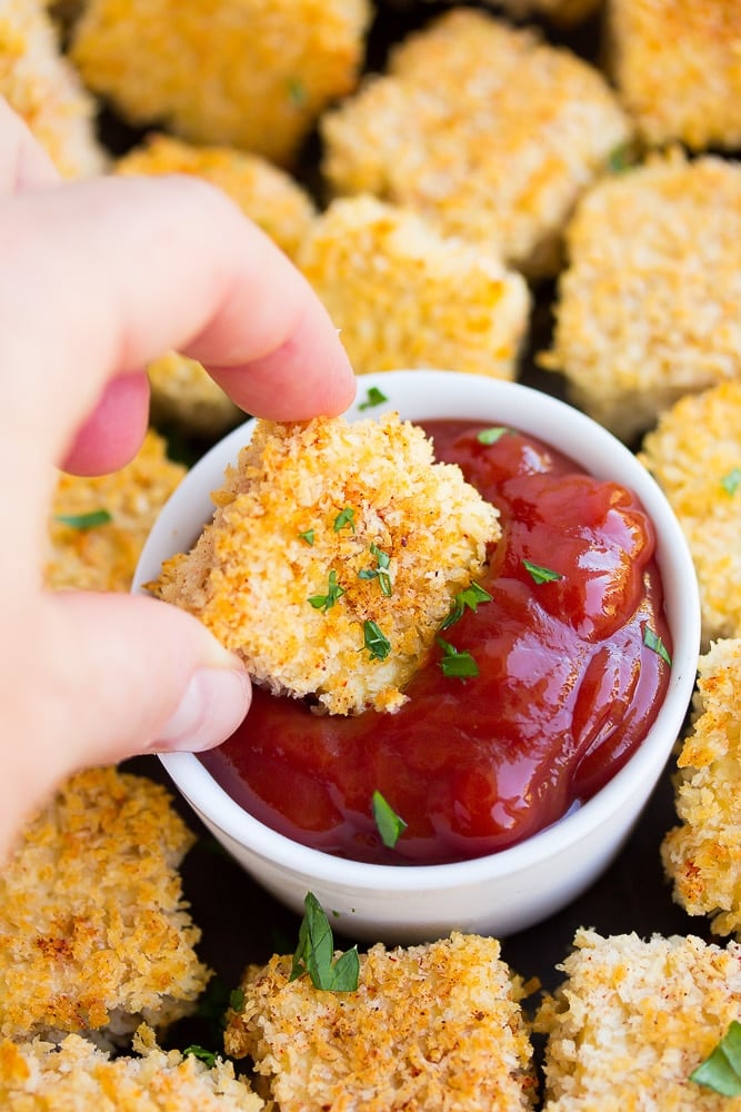 nugget being dipped into ketchup 