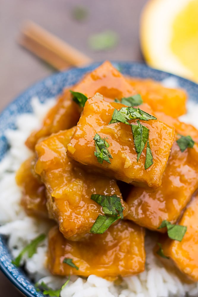 Vegan copycat recipe of Panda Express Orange Chicken, made healthy! A fresh, easy orange sauce paired with crispy no fry tofu. Serve over brown or white rice.