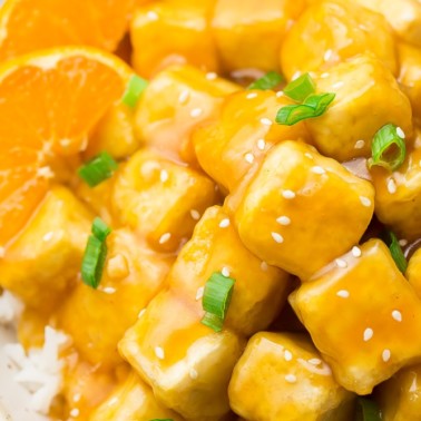 very close up shot of orange tofu