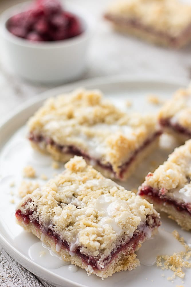 raspberry bars on a plate