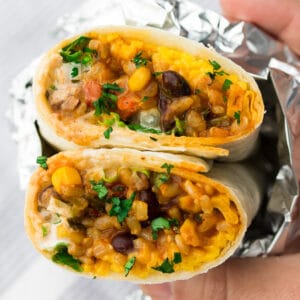 square image of vegan burrito wrapped in foil