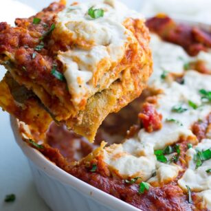 vegan lasagna being picked up from the pan.