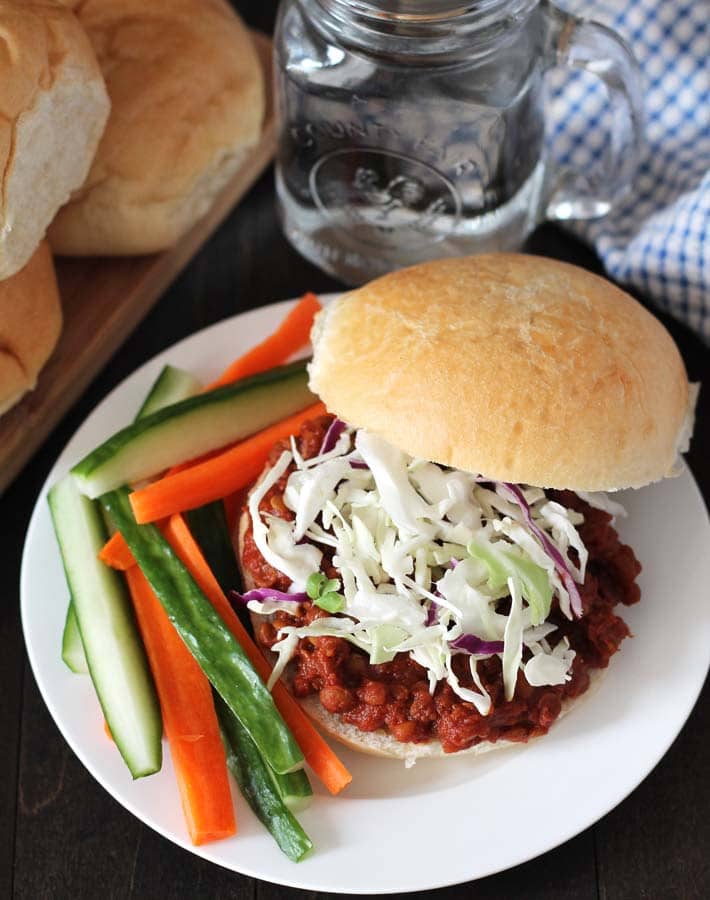 lentil sloppy joes on a burger with cabbage