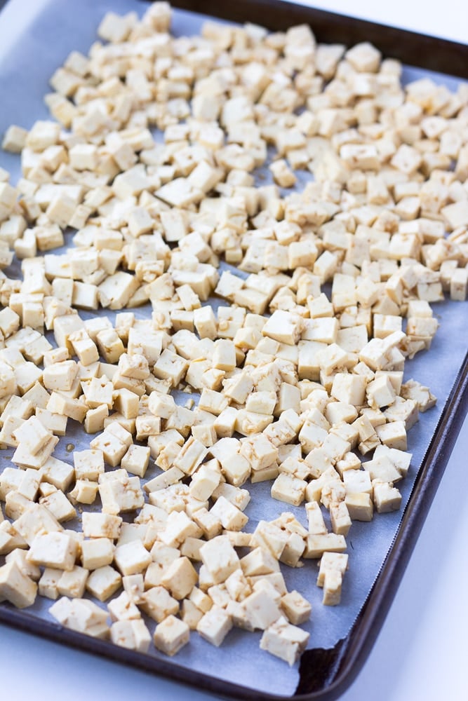 unbaked tofu pieces on a pan