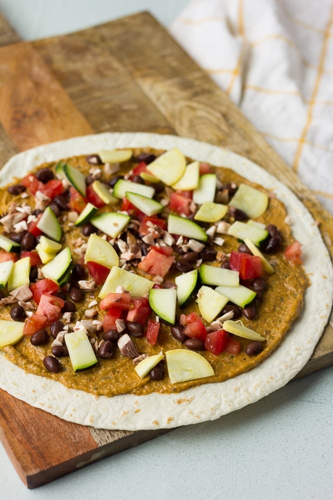 vegan quesadilla with toppings being added