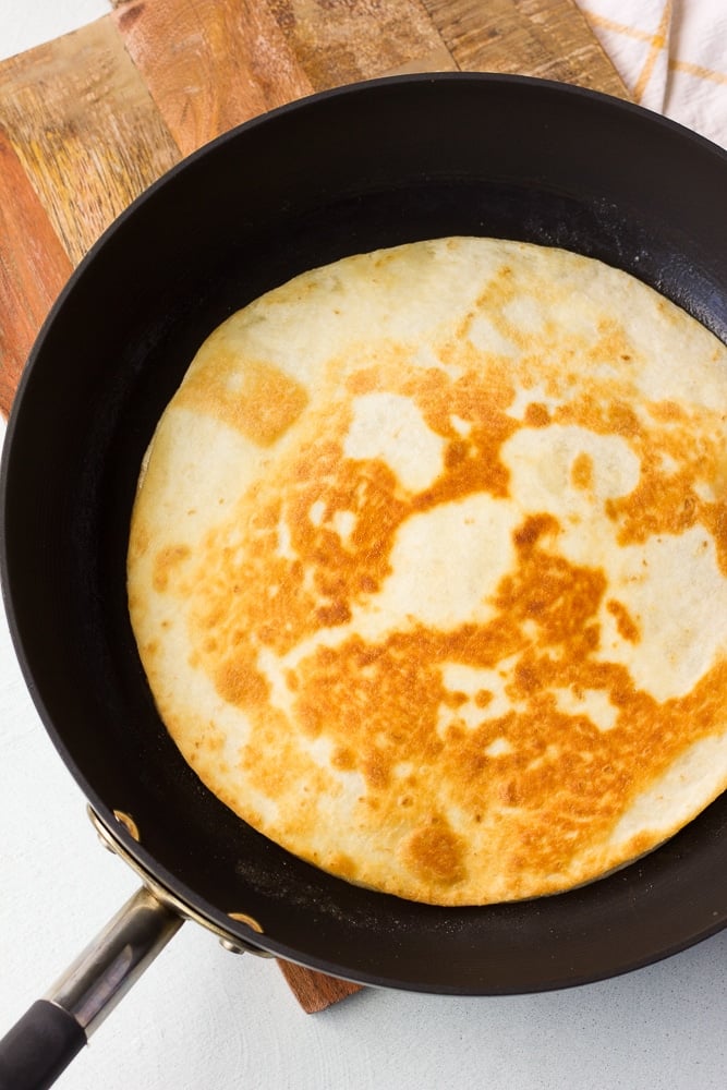 vegan quesadilla on a pan being cooked