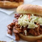 vegan bbq burger on parchment paper with coleslaw