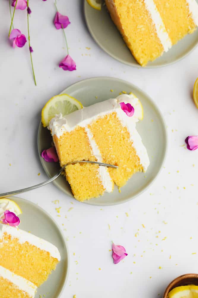 3 pieces of cake on plates with pink flowers around it