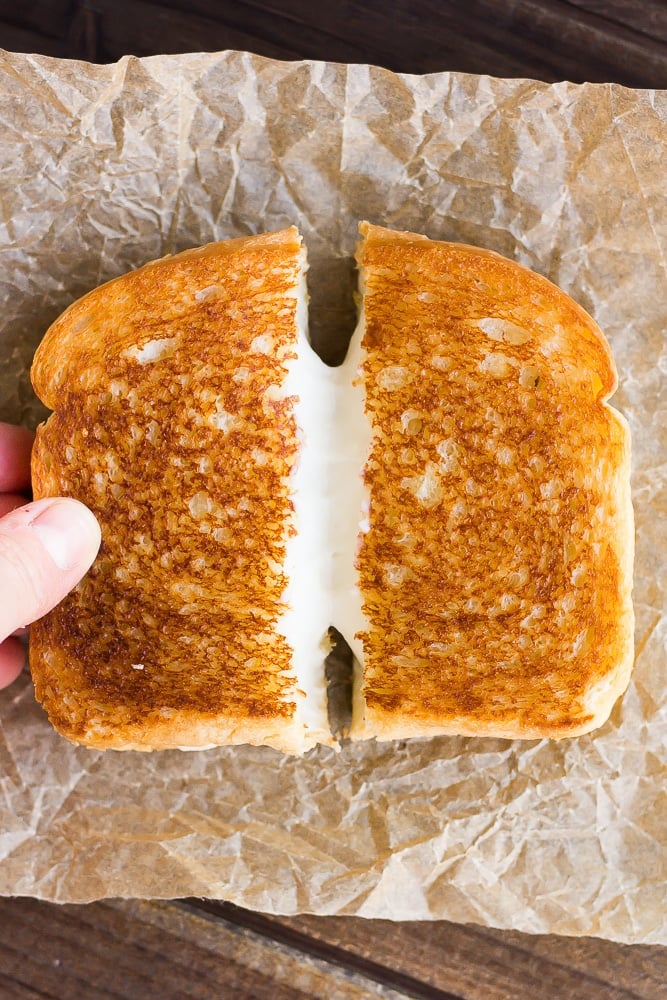 vegan grilled cheese sandwich being pulled apart