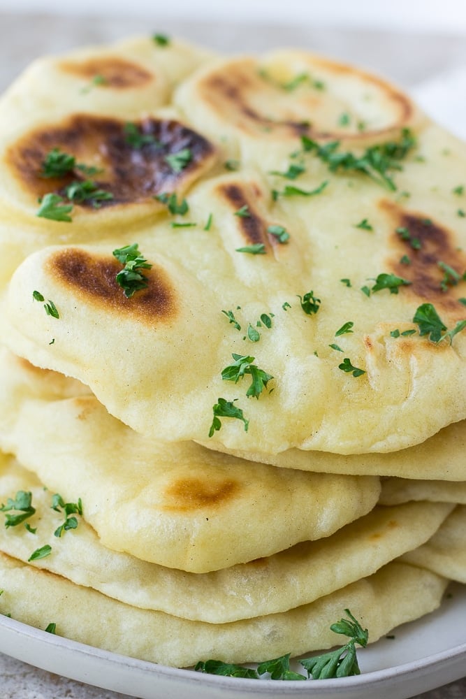 from the side photo of flatbread with parsley