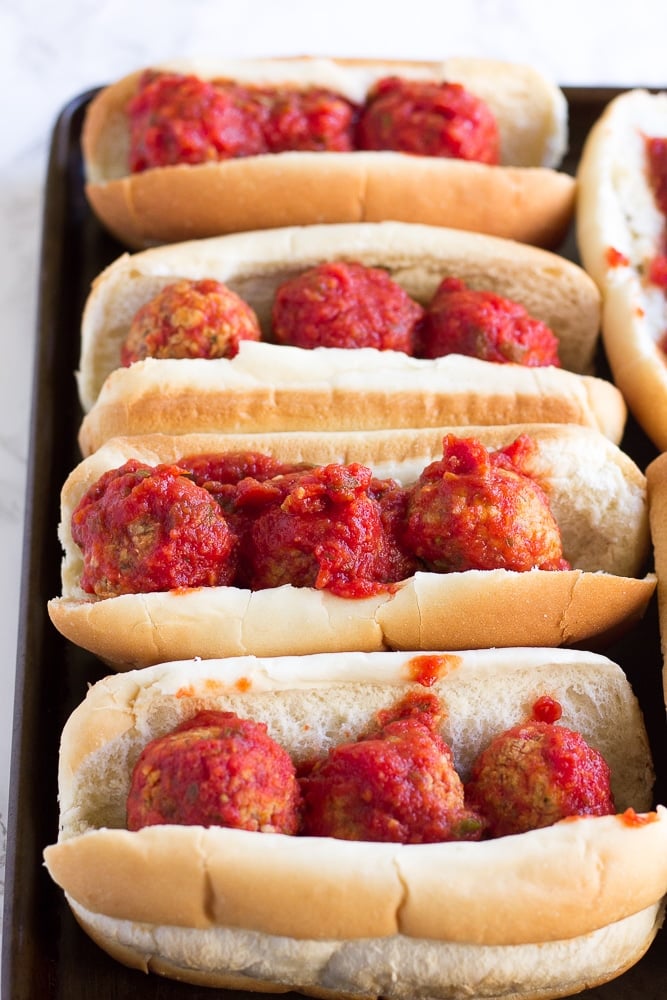 vegan meatball subs on a pan without cheese before being baked.