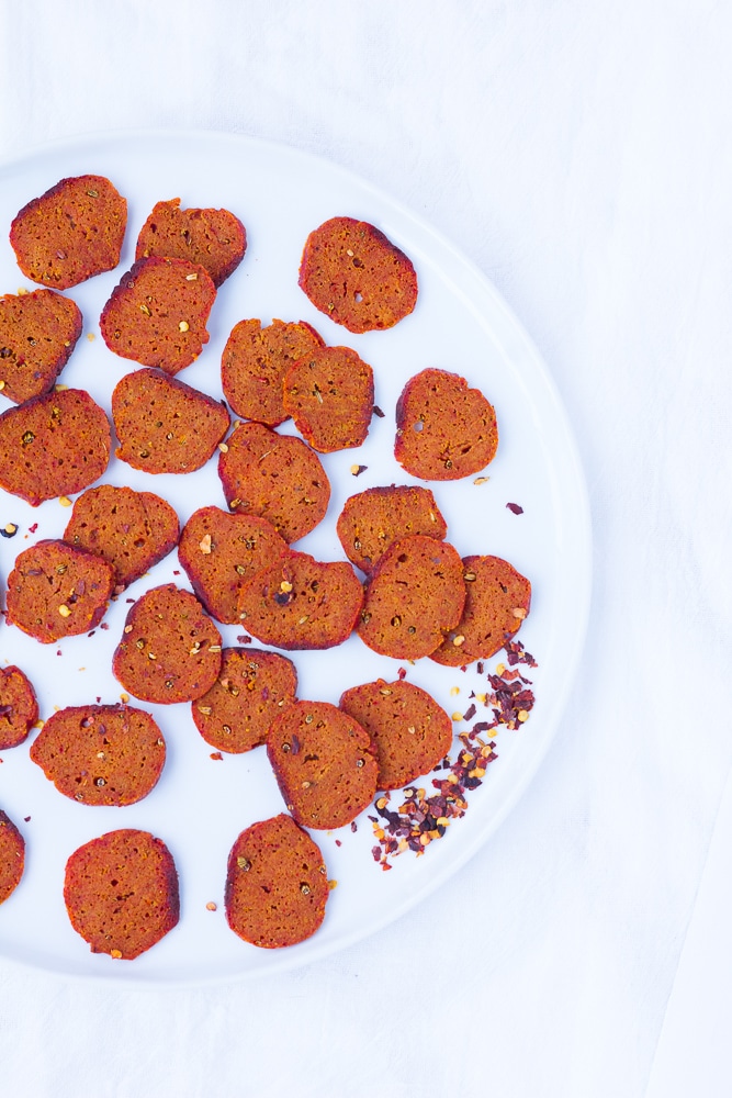 vegan pepperoni on a white plate