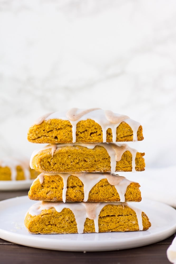 stack of vegan pumpkin scones with white background