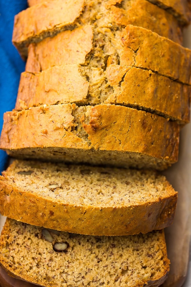 looking down on a loaf of vegan banana bread, sliced, a few slices are falling down