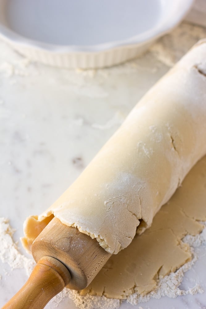 vegan pie crust rolled onto rolling pin