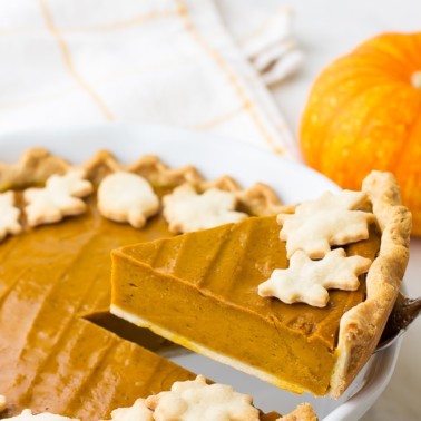 a slice of vegan pumpkin pie taken from pie plate
