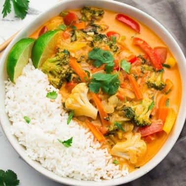 square image of a bowl of red curry with rice