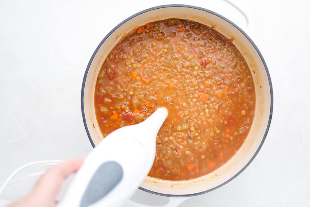 immersion blender in pot with soup