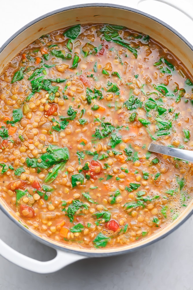 big pot of lentil soup with spinach