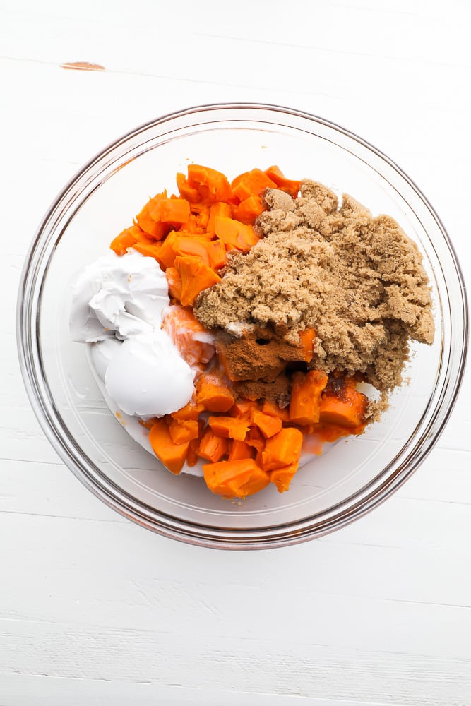 bowl of ingredients - sweet potatoes cooked, cream, sugar