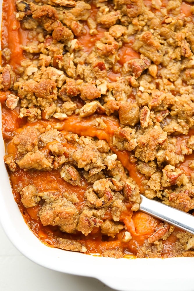 spoon in sweet potato casserole, close up