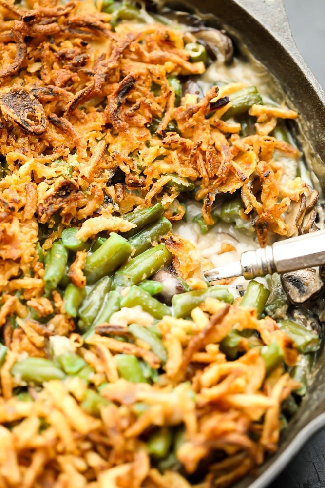 close up of vegan green bean casserole in black pan