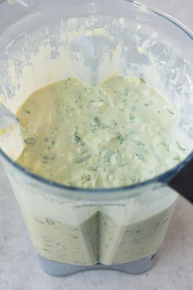 blending vegan spinach artichoke dip in blender