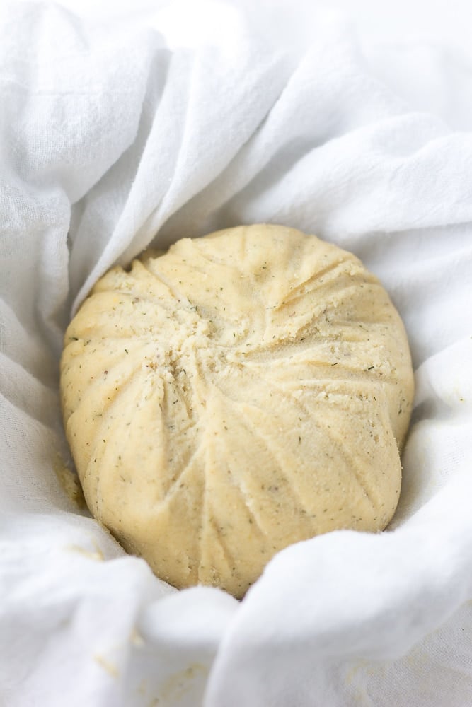 vegan cheese ball after being wrapped and chilled