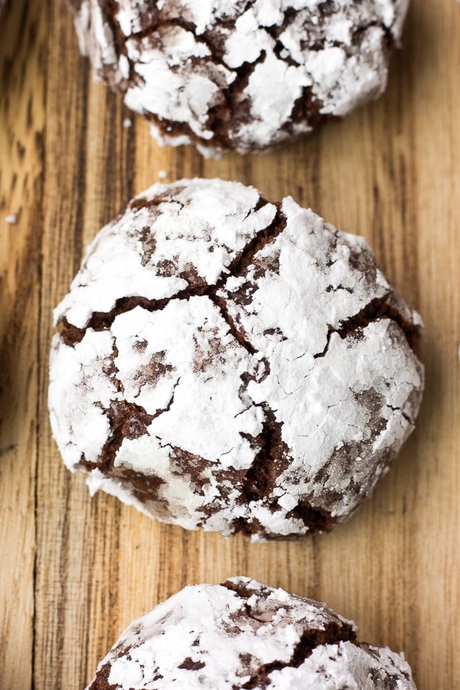 vegan chocolate crinkle cookies on wood board