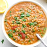 square image of a bowl of soup with a spoon in it