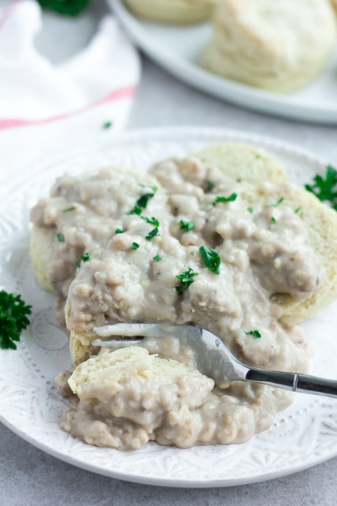 vegan biscuits and gravy on a plate with a fork