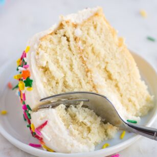 piece of vegan vanilla cake on a plate