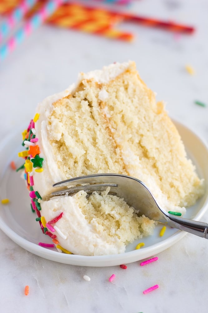 piece of vegan vanilla cake on a plate