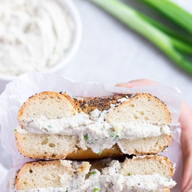 bagel cut in half with vegan cream cheese in it